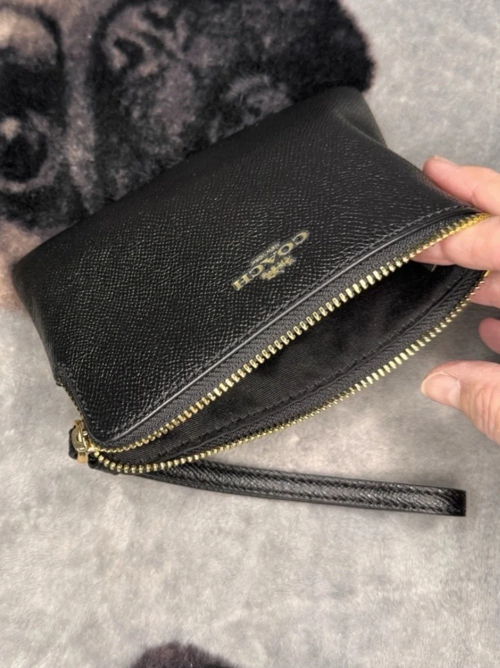 Coach Black pebbled Leather Wristlet with Gold Logo